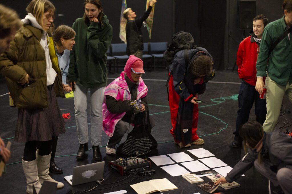 people gathered around papers, books and electronics on the floor
HAUT YC Festival 2023